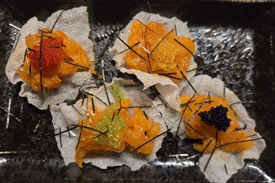 A Japanese restaurant table with small dishes.